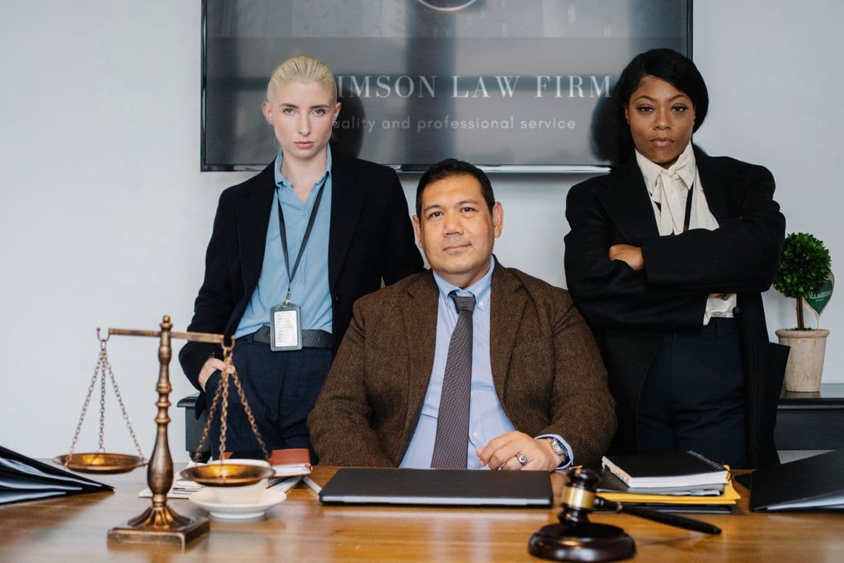 Colleagues gathered around a table with a gavel on it