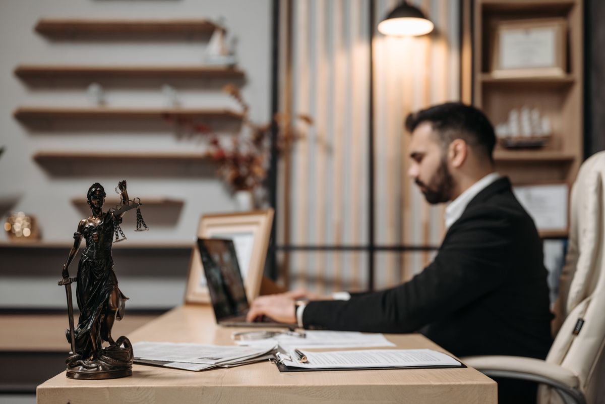 A lawyer working at a laptop