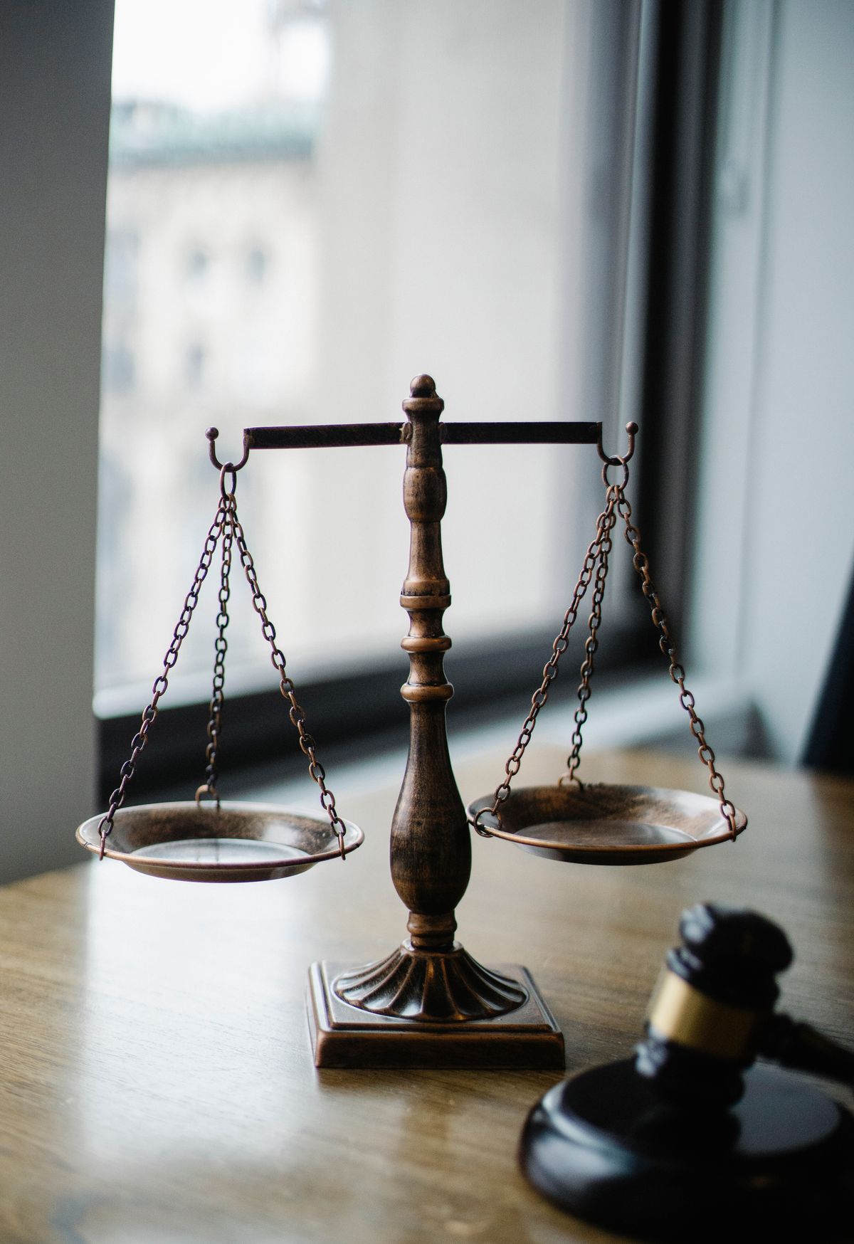 Balance scales and a gavel on a judge’s desk